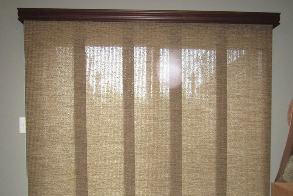 Cloth blinds installed over a window by Oregon Blinds