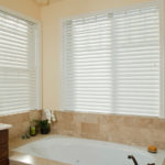 Faux wood custom blinds provide great privacy for this bathroom