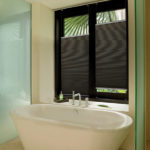 honeycomb custom blinds above this large soaking tub allow for privacy