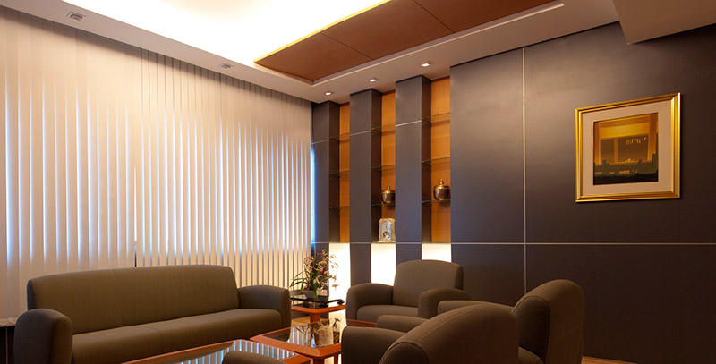 Vertical blinds provide a modern aesthetic for this living room